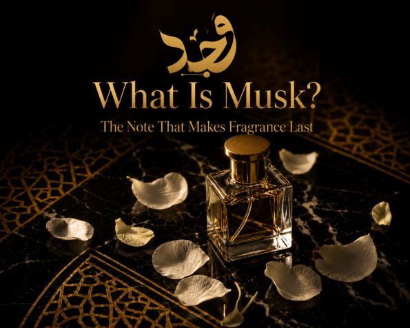 musk fragrance crystal bottle with white petals on dark marble